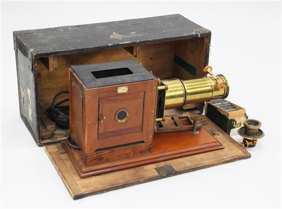 A Newton & Co lacquered brass and mahogany magic lantern, 26in.